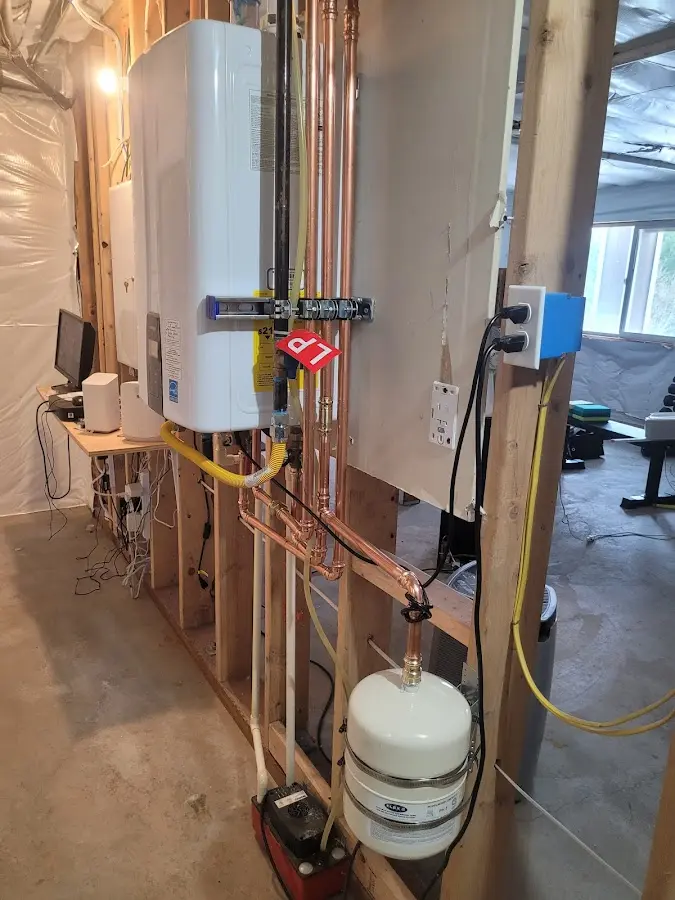 Licensed plumber repairing a kitchen sink in Dover-Foxcroft