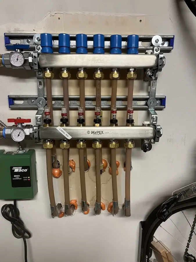 Plumber performing Water Heater Repair at a residential property in Dover-Foxcroft